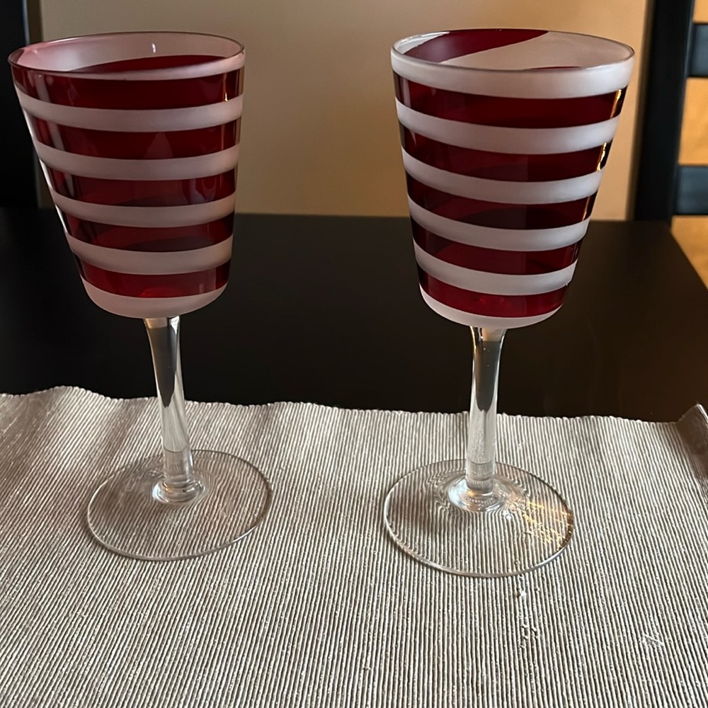 Pair of red and white votive holders.